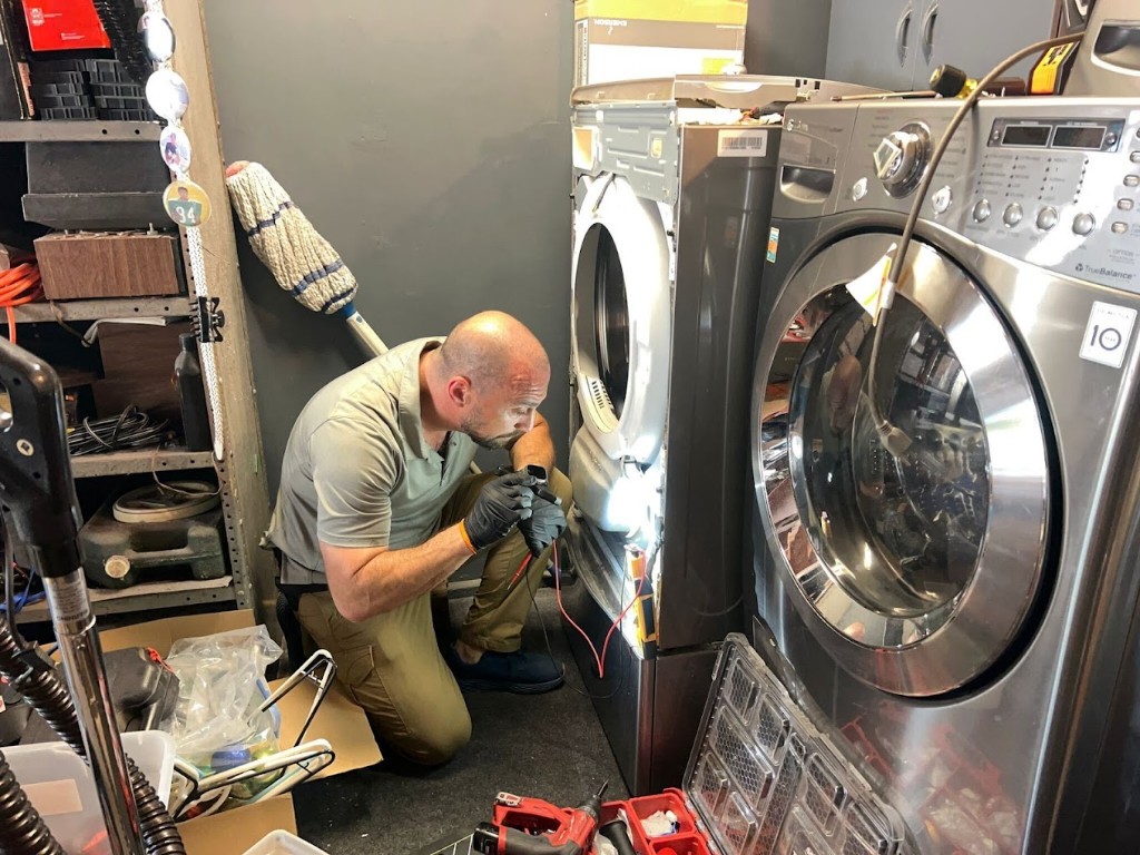 Washing machine repair San Diego technician diagnosing front load washer in San Diego